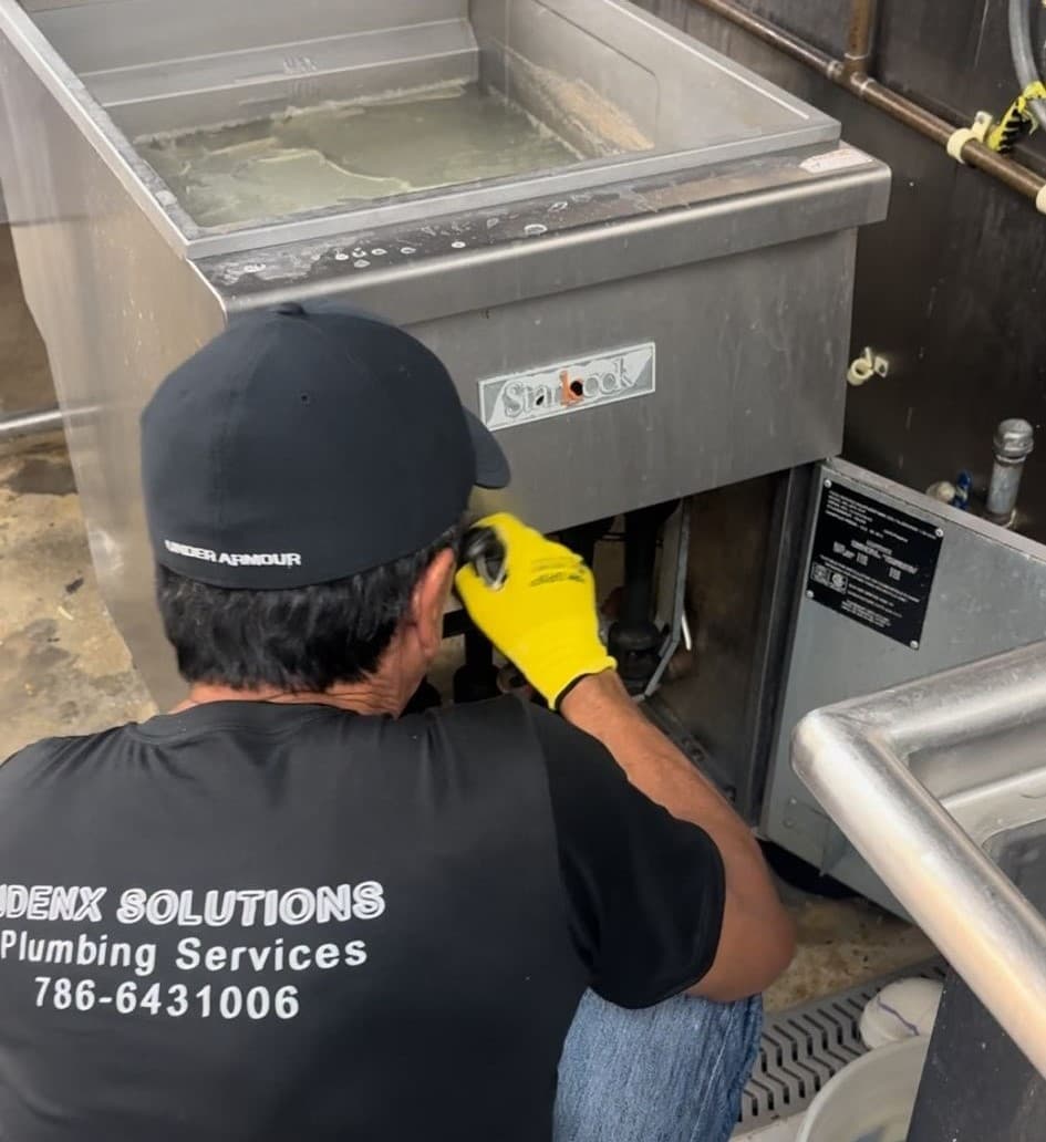 Plumber in Aventura working on a project